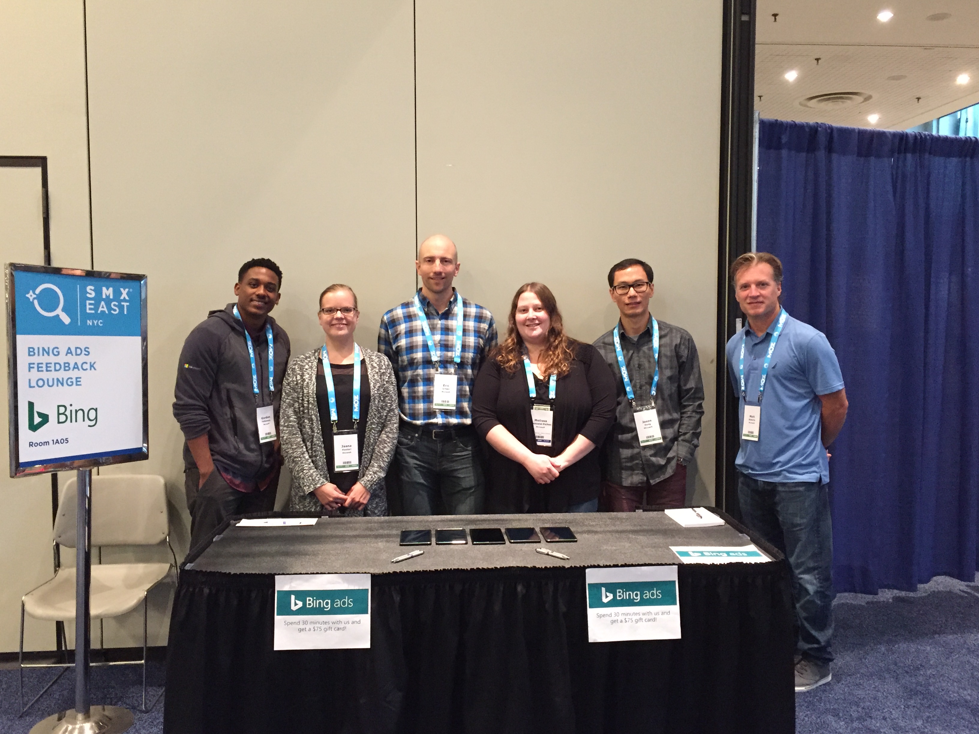 The Bing Ads team standing at their feedback lounge booth at the SMX East conference in New York City.